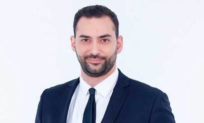 תמונת פלג גוף עליון של עו״ד טל רובינוב בחליפה