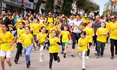 ילדים ומבוגרים עם חולצות צהובות רצים במרוץ כפר סבא, צילום: עיריית כפר סבא