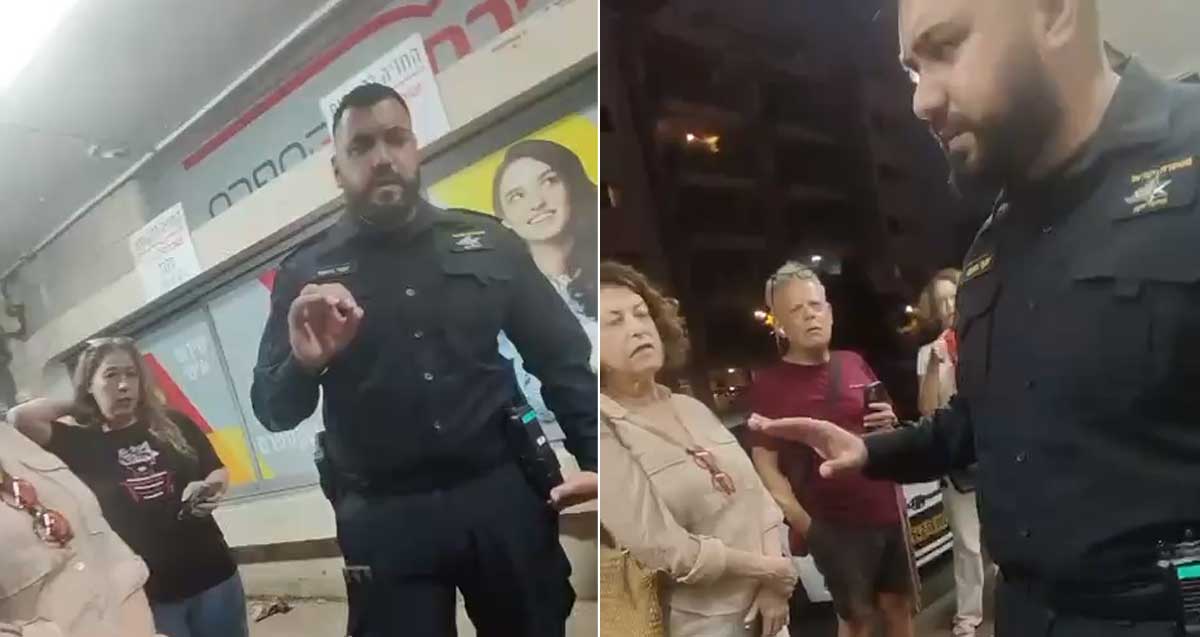 שוטר מזהיר את המפגינים ברחוב בני בנימין בהרצליה