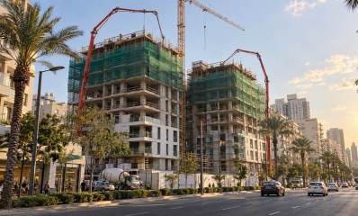 איור AI של שני בניינים בבנייה. קרדיט שרון אונליין